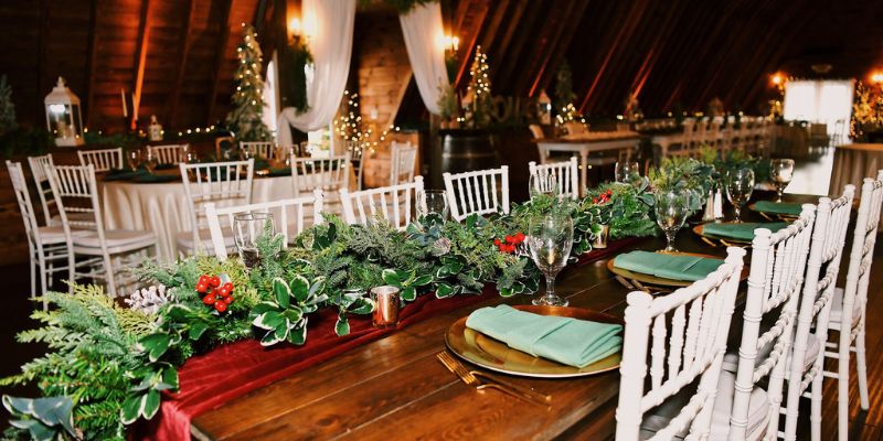 A detail shot of a table decorated with wedding frills and green florals