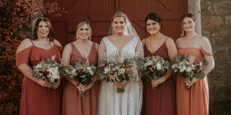 A bride posing with her bridesmaids