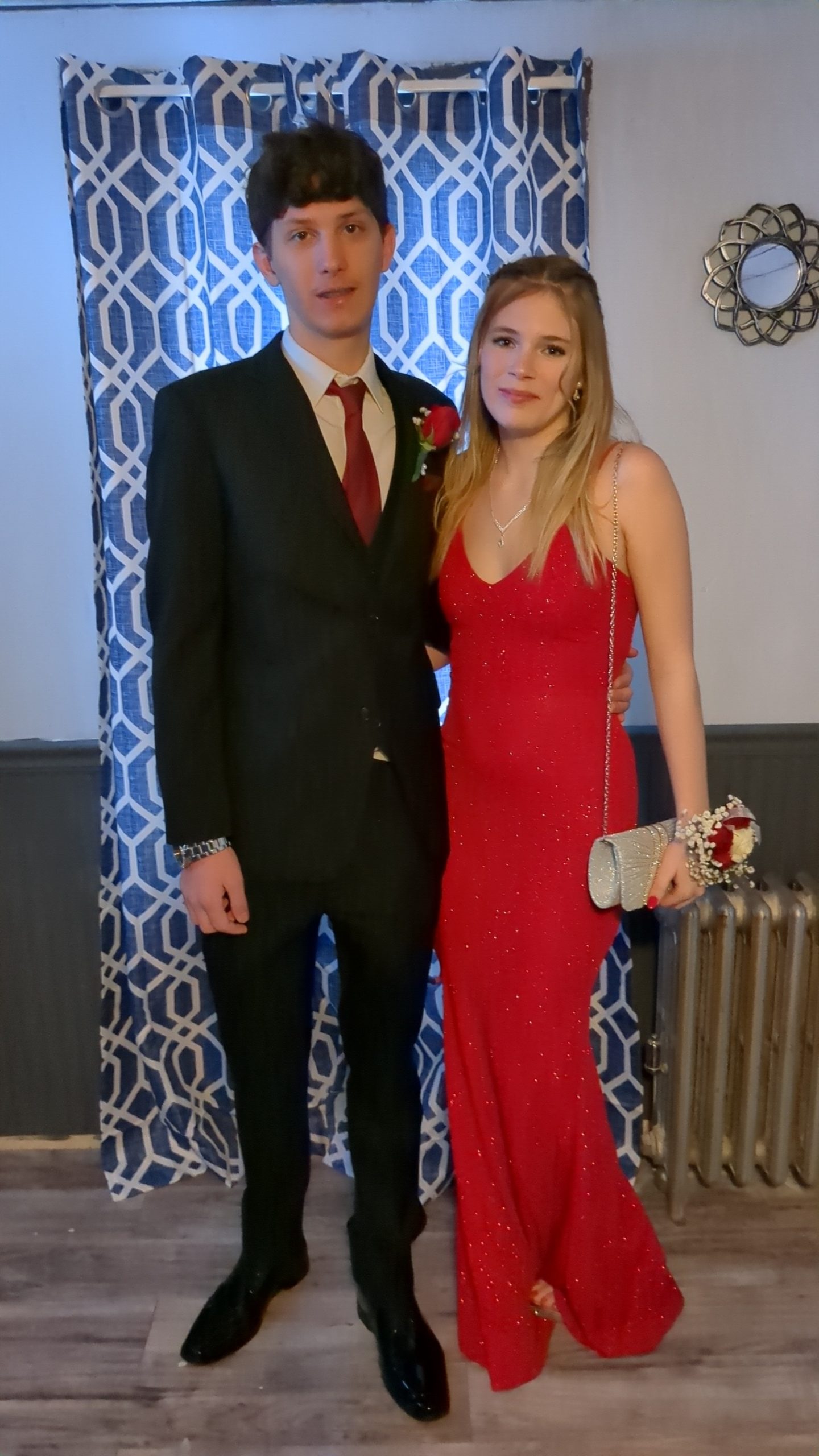 A young couple dressed in formalwear
