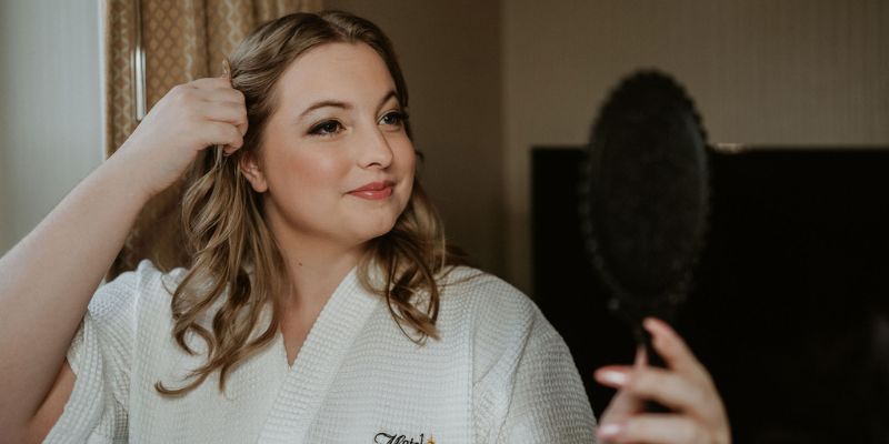 A bride doing her hair