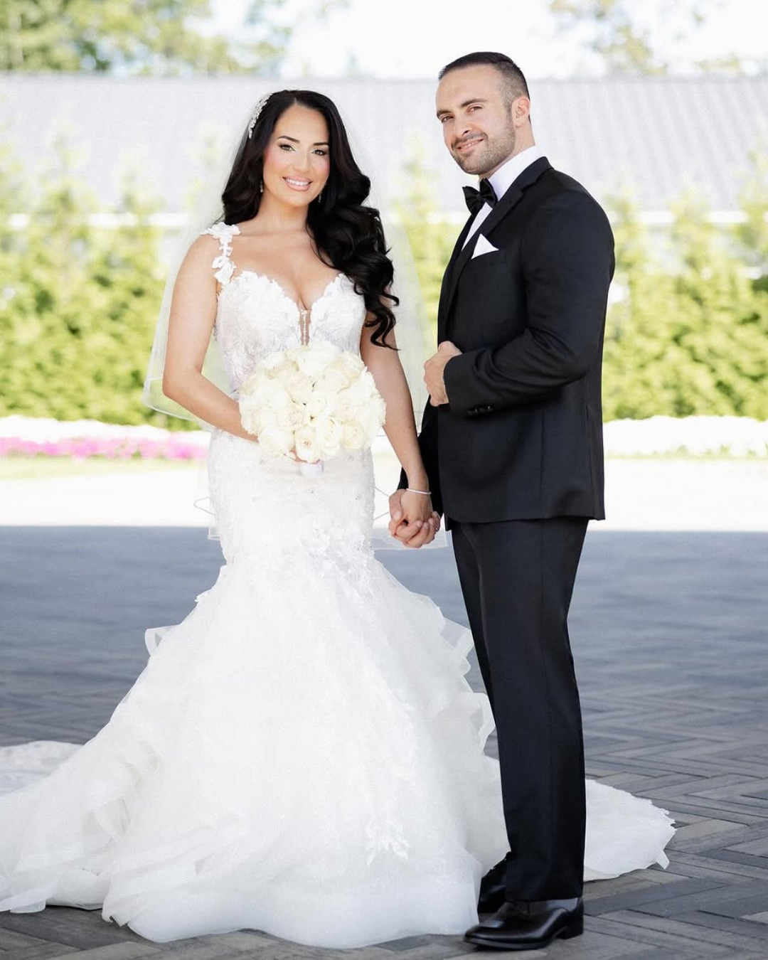 bride and groom dressed in wedding gown and tuxedo