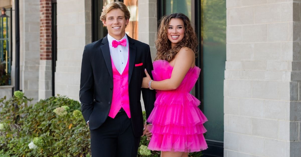 Couple in matching pink outfits.