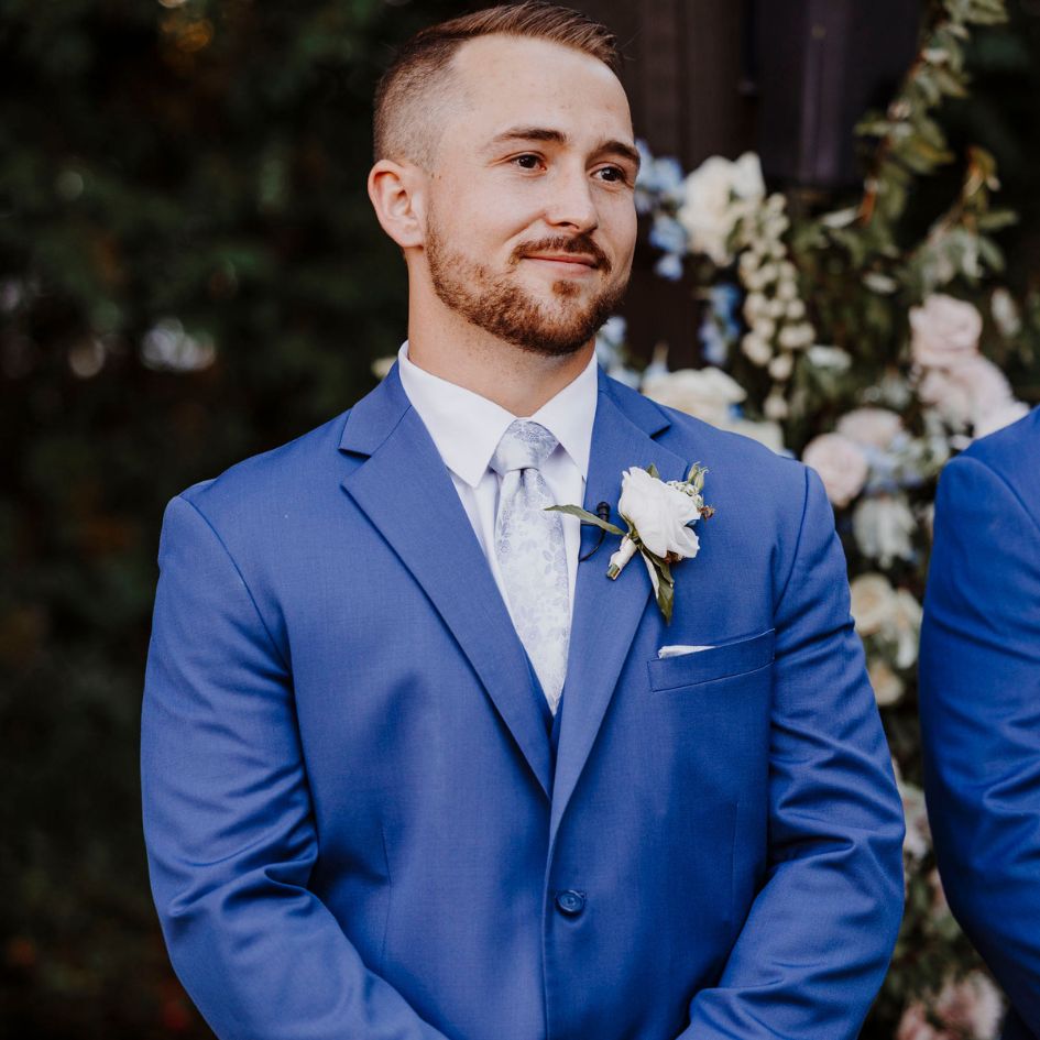 While fashion-forward colors are trending, navy continues to be one of the most versatile wedding suit colors available.